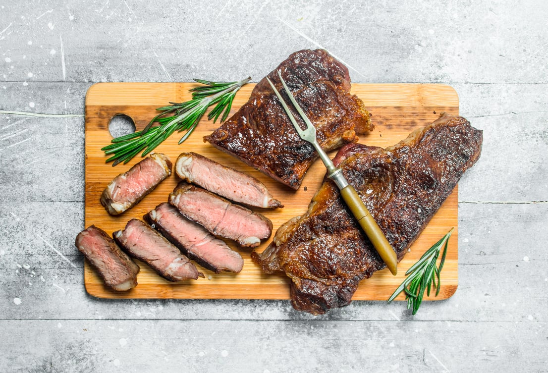 Grilled beef steak with rosemary and spices.